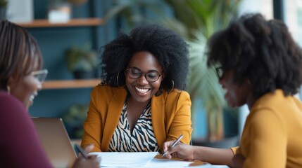 Office meeting, people sign paper to confirm deal closure. Smiling African American woman guides her female client to sign