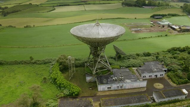 Drone fly over parabolic antenna radio station on cloudy day in Sao Miguel Island, Azores