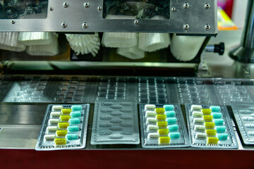 Capsule medicine pill production line, Industrial pharmaceutical concept.	