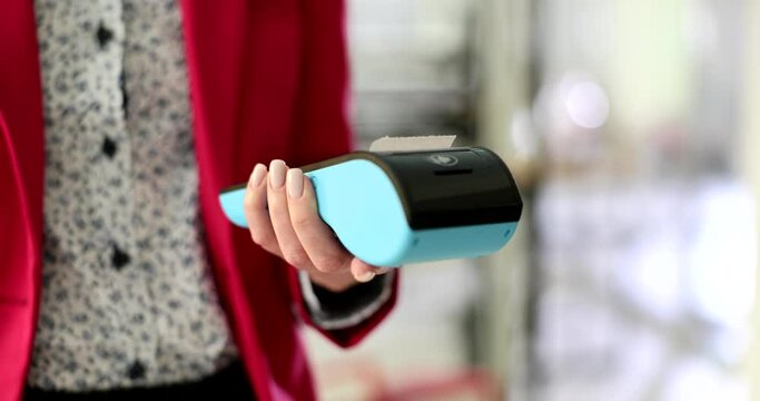 Manager helps to pay for service using terminal. Cashless payment method and the concept of electronic payments and payouts