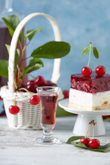 Cherry liqueur in a carafe and glasses
