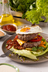 Beef burger without a bun with a fried egg