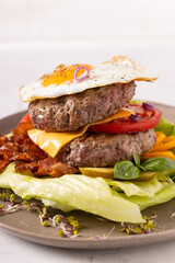 Beef burger without a bun with a fried egg