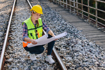 Engineer railway tracks construction service team working on site survey checking and maintenance...