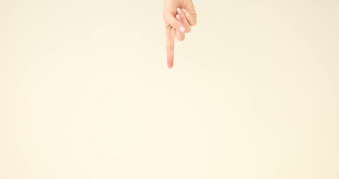 Hand indicates thumbs down gesture. One human hand pointing down concept