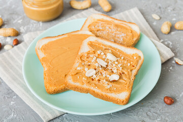 Peanut butter sandwiches or toasts on light table background.Breakfast. Vegetarian food. American cuisine top view vith copy space