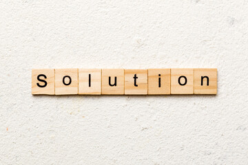 solution word written on wood block. solution text on table, concept