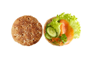 Traditional scandinavian open toast with cheese cream, smoked salted salmon, lettuce, cucumber slices and herbs isolated on white