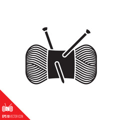 Bundle of wool yarn with knitting needles vector glyph icon