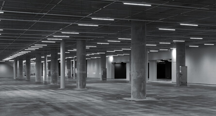 Abstract empty industrial interior with concrete pillars and neon lights