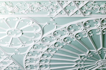 Ceiling design elements in Gothic style. White gypsum bas-relief