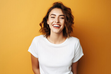 Fototapeta premium Young happy woman, smiling gen z girl model wearing tshirt looking at camera standing on color background. Face skin care cosmetics makeup, fashion ads. Beauty portrait. White t-shirt mock up template