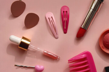 Obraz premium Various pink accessories and make up products on bright pink background. Flat lay.