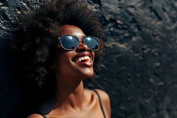 a woman wearing sunglasses and smiling