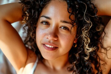 a woman with curly hair and freckles