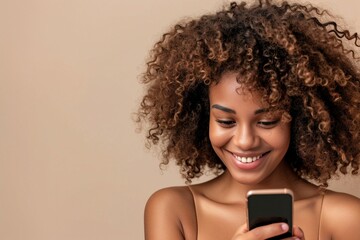 a woman smiling at a cellphone