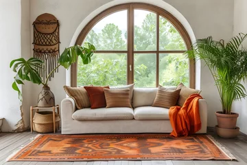 Photo sur Plexiglas Style bohème A modern living room adorned with a corner sofa against an arched window, embracing the boho ethnic charm in its interior design.