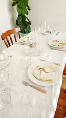 dining table decorated with plates and glasses