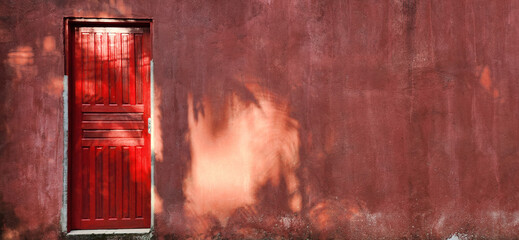 old house with red door and rustic wall - Powered by Adobe