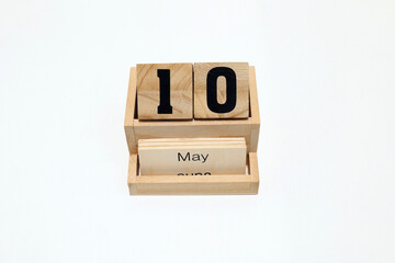 10th of May wooden perpetual calendar. Shot close up isolated on a white background