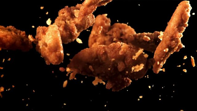 Chicken nuggets fly up and fall down. Filmed on a high-speed camera at 1000 fps. High quality FullHD footage