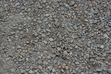 A construction road covered with gray small pebbles.