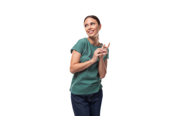 attractive young caucasian woman with black hair in a t-shirt smiling on a white background