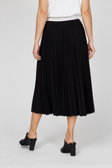 Black women's luxury Classic Long Maxi pleated skirt on model isolated on white background. Woman...