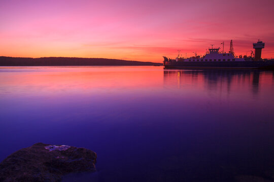Silhouette of a ship in port of Klaipeda at sunset, Lithuania