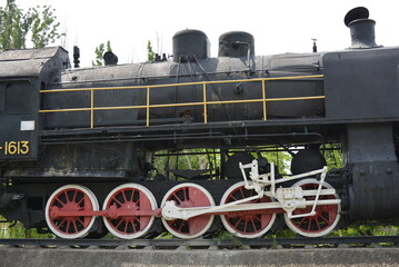 Fototapeta na wymiar Soviet steam locomotive SO-17-1613, which reached Berlin and Potsdam along the front-line tracks. This large black, metal locomotive brought a Soviet delegation headed by J. V. Stalin.