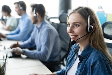 Call center, computer and business with woman in office for customer service, technical support and advice. Technology, contact us and communication with employee operator in help desk agency - Powered by Adobe