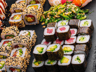 Sushi set on black stone background