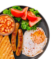 english breakfast on black pan top view