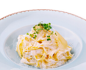 Tagliatelle pasta with cream sauce and parmesan cheese