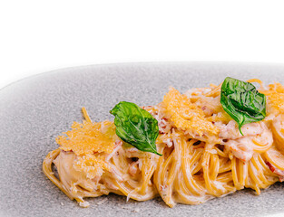 Spaghetti carbonara on white plate isolated