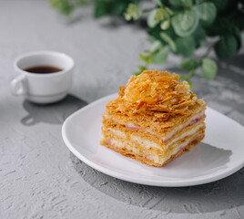 Napoleon cake slices with cup of coffee