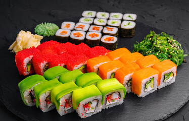 Sushi set on black stone background