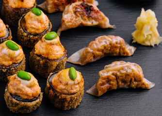 Gyoza or dumplings snack and warm sushi top view