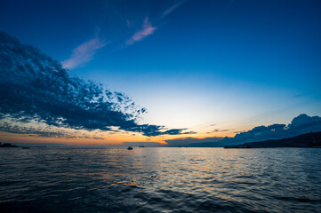 Dusk and night in Trieste. Between historic buildings and the sea.