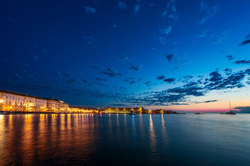 Fototapeta na wymiar Dusk and night in Trieste. Between historic buildings and the sea.