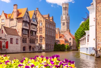 Poster Scenic sunny medieval fairytale town and tower Belfort from the quay Rosary in Bruges, Belgium © Kavalenkava
