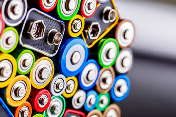 Energy abstract background of colorful batteries.Old used batteries ready for recycling.Used...