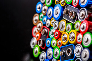 Energy abstract background of colorful batteries.Old used batteries ready for recycling.Used...