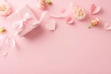 Foto op Aluminium Shower your glam queen with love! Top view capture of radiant peony roses, heart symbols, and an elegantly packaged gift on a serene pastel pink background. Ideal for your Women's Day dedication © ActionGP