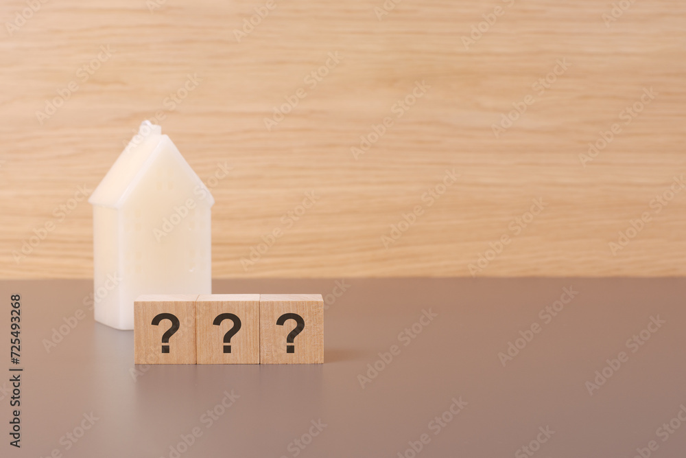 Aufkleber cubes form the questions mark on a light background there is a row of cubes and a toy house in the b