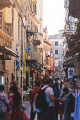 Fototapeta na wymiar Corfu street view, Kerkyra old town beautiful cityscape, Ionian sea Islands, Greece, a summer sunny day, pedestrian streets with shops and cafes, architecture of historic center, travel to Greece