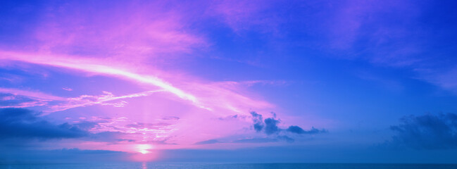 Naklejka na ściany i meble Early morning on the beach. Pink sunrise over the sea. Horizontal banner