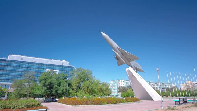 MIG-21 Monument Timelapse Hyperlapse in the Square of Glory, Aktau, Kazakhstan. Sunny Day with a Vibrant Blue Sky, Capturing the Timeless Tribute to Aviation Excellence
