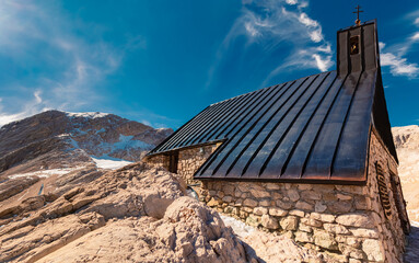 High resolution stitched alpine summer panorama with a chapel at Schneeferner glacier, Mount...