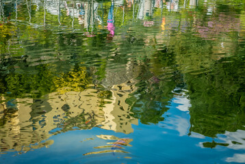 Botanical gardens and Trauttmansdorff Castle are reflected in the pond. Merano (South Tyrol), Trentino Alto Adige, northern Italy, Europe, May 13, 2023
